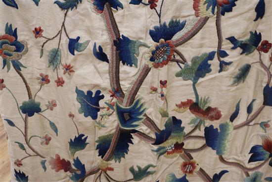 A crewel worked panel and another similar in green